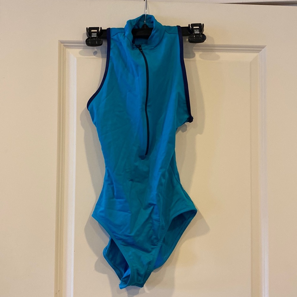 Size M. Light blue with navy blue trim. Lightly worn